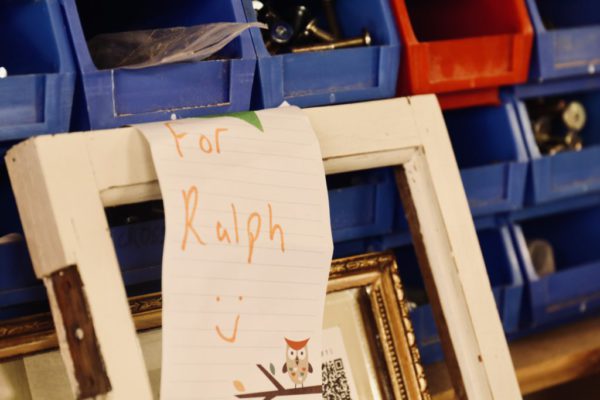 Work drawers containing carpenters equipment and tools with a note hanging up which reads: "For Ralph"